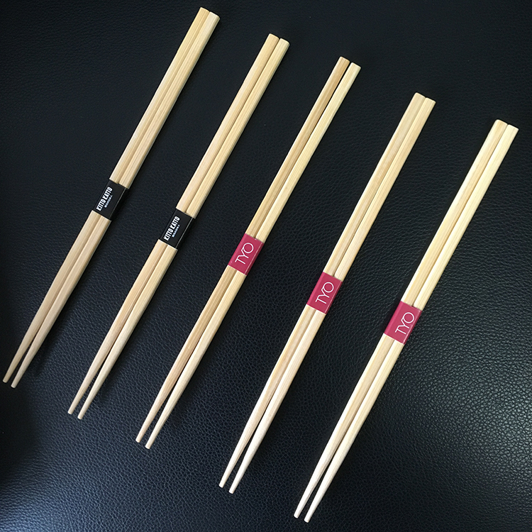 Dan chopsticks with paper wrap in middle